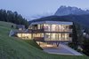 Modern home with Exterior, Shed RoofLine, Metal Siding Material, House Building Type, Green Roof Material, Glass Siding Material, Metal Roof Material, and Flat RoofLine. Set on a steep slope, the building features angled geometry that mimics the mountains and terrain. Photo 2 of Family Resort Rainer
