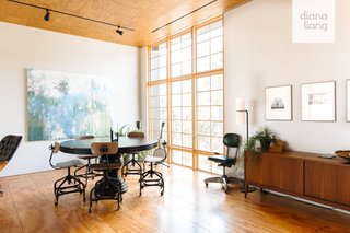 Vintage Toledo Metal Furniture Co. chairs are combined with a round dining table. The console was purchased at a garage sale.