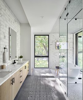 A peek inside the light-dappled master bath.