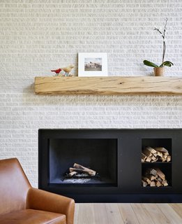 The fireplace mantel was crafted from an oak tree felled on the property.