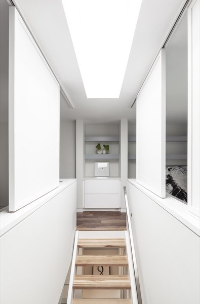 Open-tread, two-inch, hickory butcher block stairs allow natural light to penetrate deep inside the home.