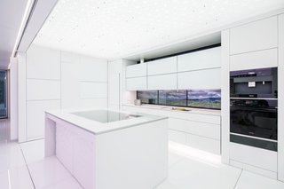 In the kitchen, adjustable counter heights can accommodate users of all ages. A smart faucet dispenses water with a voice command, electronic mixing valves regulate water temperatures, and a backsplash touch interface monitors cooking performance.