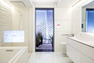 Designed to accommodate virtually any user, the bathroom comprises two separate areas—one for bathing and showering, and one with a toilet, vanity, and touchscreen smart mirror. A closed-loop water recycling system in the shower cuts down on water usage by 90 percent compared to standard showers.