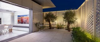 The home's doors have three automated layers: a clear glass insulated door for enclosure, a frosted insulated glass door for privacy and protection against sun glare, and a bug-screen. The doors can be controlled via touchscreen interface. 