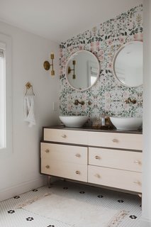 In the master bath, a West Elm dresser was converted into a double vanity.