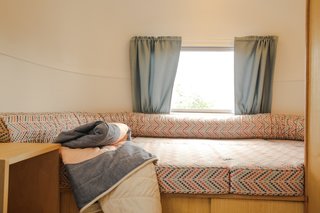 The day bed in the rear of the Airstream serves as the "chill out zone."