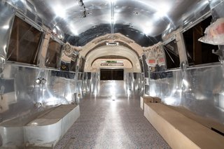Before: The original walls were clad in aircraft aluminum, however Eoin and Robin found that the material overwhelmed the space. As a result, they painted much of it white.