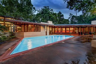 The parallelogram-shaped pool is located right outside the Thaxton House master bedroom.