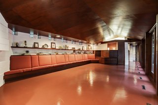 8" x 8" windows top the concrete block walls. Polished red concrete floors feature throughout the home.