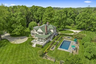 Set on a 10.8-acre property surrounded by country estates, Beanfield lies secluded within a beautiful setting of old-growth trees, stone walls, open meadows, and stellar plantings.