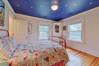 A peek inside the smallest bedroom. All four bedrooms include large windows and private baths.