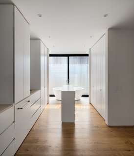 A peek inside the master bathroom that takes up approximately one-sixth of the upper floor. The house includes three bedrooms on the upper floor and a service bedroom on the ground floor.