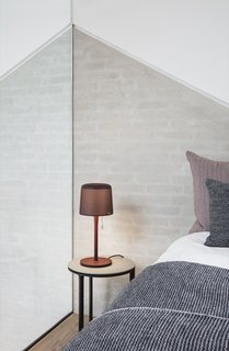 The Vipp table lamp ($259) features a perforated metal lampshade and pull string.