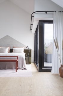 The master bedroom also enjoys access to a private terrace through sliding glazed doors. A privacy curtain can be pulled along the ceiling track.