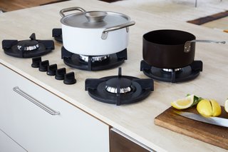 A close-up view of the PITT Cooking stovetop. The pots are by kindustrie.
