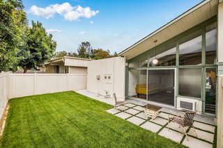 Both units have access to separated fenced-in backyards. 