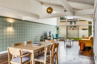 Floor-to-ceiling windows pull the outdoors in.