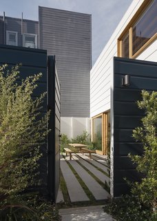 The garden courtyard is the first space the owners experience when entering from the street.