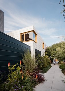 "While the house enjoys its inner garden and cloister-like character, a major aim of the project was to give back to the neighborhood through the creation of a public green space along the property line," says Ryan. "To do so, large sections of the sidewalk around the house were removed and converted to lush planting beds, which the owners tend."