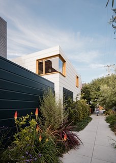 “While the house enjoys its inner garden and cloister-like character, a major aim of the project was to give back to the neighborhood through the creation of a public green space along the property line,” says Ryan. “To do so, large sections of the sidewalk around the house were removed and converted to lush planting beds, which the owners tend.”