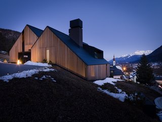 The complexity of the very steep, rock-studded site was a big challenge for the architects. Here is an image of the west side of the house, where the service areas, garage, and entrance are located.