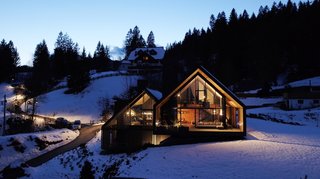 A view of the Z House illuminated at night.