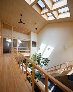 A sloped walkway connects the tatami room to the children’s bedrooms. "The level change gives the kids more of a sense of transition from one place to another," explains Chikamori. "It also gives more height to the downstairs kitchen, which should be bright and spacious for the wife. In contrast, the height of the master bedroom under the tatami room is kept lower because that room is only used for sleeping."