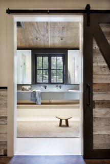 A peek inside the bathroom opposite the bunk room.