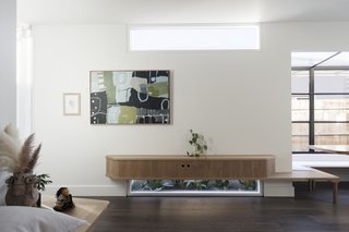 Local artisan Daniel Poole designed timber built-ins that help maximize space in the house.