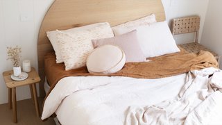 Leÿer produces surf-inspired timber furniture—including pieces like this half-moon headboard.