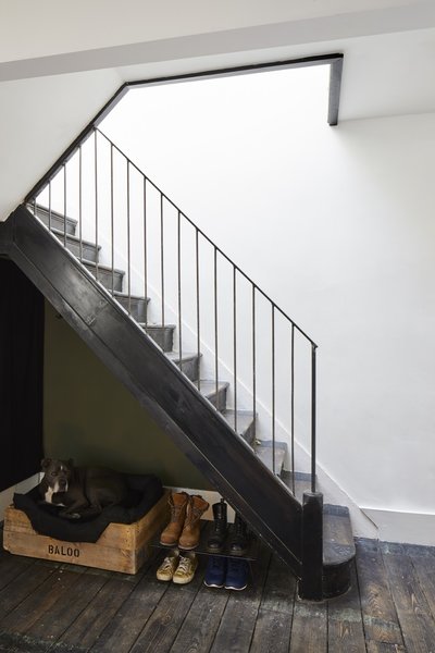 The stairs were stripped back to just the steps and upgraded with a new steel handrail and spindles. The treads were finished with OSMO ebony oil.