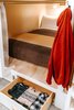 Modern home with Bedroom, Wall Lighting, Storage, Bunks, and Concrete Floor. All bunks come with built-in lockable storage. Guests also have access to an individual locker and larger luggage storage. Photo 7 of Cache House