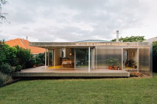 The new west-facing extension is wrapped in a mill-finished aluminum skin that changes color throughout the day and seasons. In the summer, the silver facade reflects a rose-colored glow, and in winter it shines a cool blue.