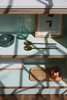 Modern home with Kitchen, Wood Cabinet, Medium Hardwood Floor, Colorful Cabinet, and Engineered Quartz Counter. Kitchen shelves detail, in mint green and birch plywood. Photo 2 of C Studio Apartment