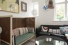 Modern home with Living Room, Sofa, and Pendant Lighting. A high-framed bench with colorful striped cushions brings even more interest to the living room. Photo 16 of Colorful & Eclectic Danish Home
