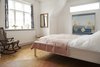 Modern home with Chair. The master bedroom is both contemporary and classic at the same time. Photo 18 of Colorful & Eclectic Danish Home