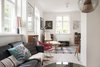 Modern home with Living Room, Sofa, Chair, Pendant Lighting, and Light Hardwood Floor. The eclectic living room is full of different patterns and types of material. Photo 12 of Colorful & Eclectic Danish Home