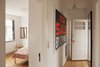 A black and neon orange For Sale sign hangs in the hallway outside the master bedroom, adding a bit of whimsy to the space. Photo 19 of Colorful & Eclectic Danish Home modern home