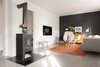 Modern home with Living Room, Bench, Chair, Sofa, Floor Lighting, Medium Hardwood Floor, Rug Floor, and Wood Burning Fireplace. Nordic living room featuring black wood burning stove, orange rug, and grey wall, floors, and furniture. Photo 6 of Minimalist Nordic Flat