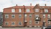 Modern home with Exterior, Apartment Building Type, Shingles Roof Material, and Brick Siding Material. A typical Copenhagen apartment building Photo 8 of Minimalist Nordic Flat
