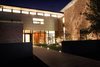 Modern home with Exterior, Metal Roof Material, House, Brick Siding Material, Shed RoofLine, and Concrete Siding Material. Front Elevation Photo of Before House