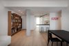 Modern home with Living Room, Sofa, Chair, Bar, Desk, Shelves, Stools, Table, Ceiling Lighting, and Medium Hardwood Floor. Living room Photo 3 of D House