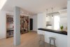 Modern home with Living Room, Shelves, Desk, Lamps, Medium Hardwood Floor, and Pendant Lighting. Living room Photo 6 of D House