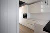 Modern home with Kitchen, Pendant Lighting, Quartzite Counter, Laminate Cabinet, Ceiling Lighting, and Medium Hardwood Floor. Kitchen Photo 7 of D House