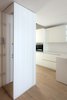 Modern home with Kitchen, White Cabinet, Laminate Cabinet, Quartzite Counter, Laminate Counter, and Medium Hardwood Floor. Kitchen Photo 9 of D House