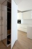 Modern home with Kitchen, Quartzite Counter, Laminate Counter, White Cabinet, Laminate Cabinet, and Medium Hardwood Floor. Kitchen Photo 10 of D House