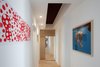 Modern home with Living Room, Ceiling Lighting, Shelves, and Medium Hardwood Floor. Interior Photo 11 of D House