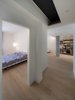 Modern home with Bedroom, Bed, Dresser, Floor Lighting, Medium Hardwood Floor, Wardrobe, and Ceiling Lighting. Bedroom Photo 12 of D House