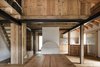 Modern home with Dining Room, Table, Pendant Lighting, and Medium Hardwood Floor. Dining room Photo 10 of Renovation of an Alpine Barn