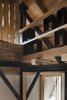 Modern home with Living Room, Medium Hardwood Floor, and Wall Lighting. Detail Photo 15 of Renovation of an Alpine Barn